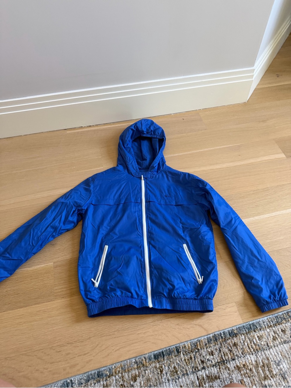 Kids size 12 Lacoste rain coat blue, lightly used in great condition